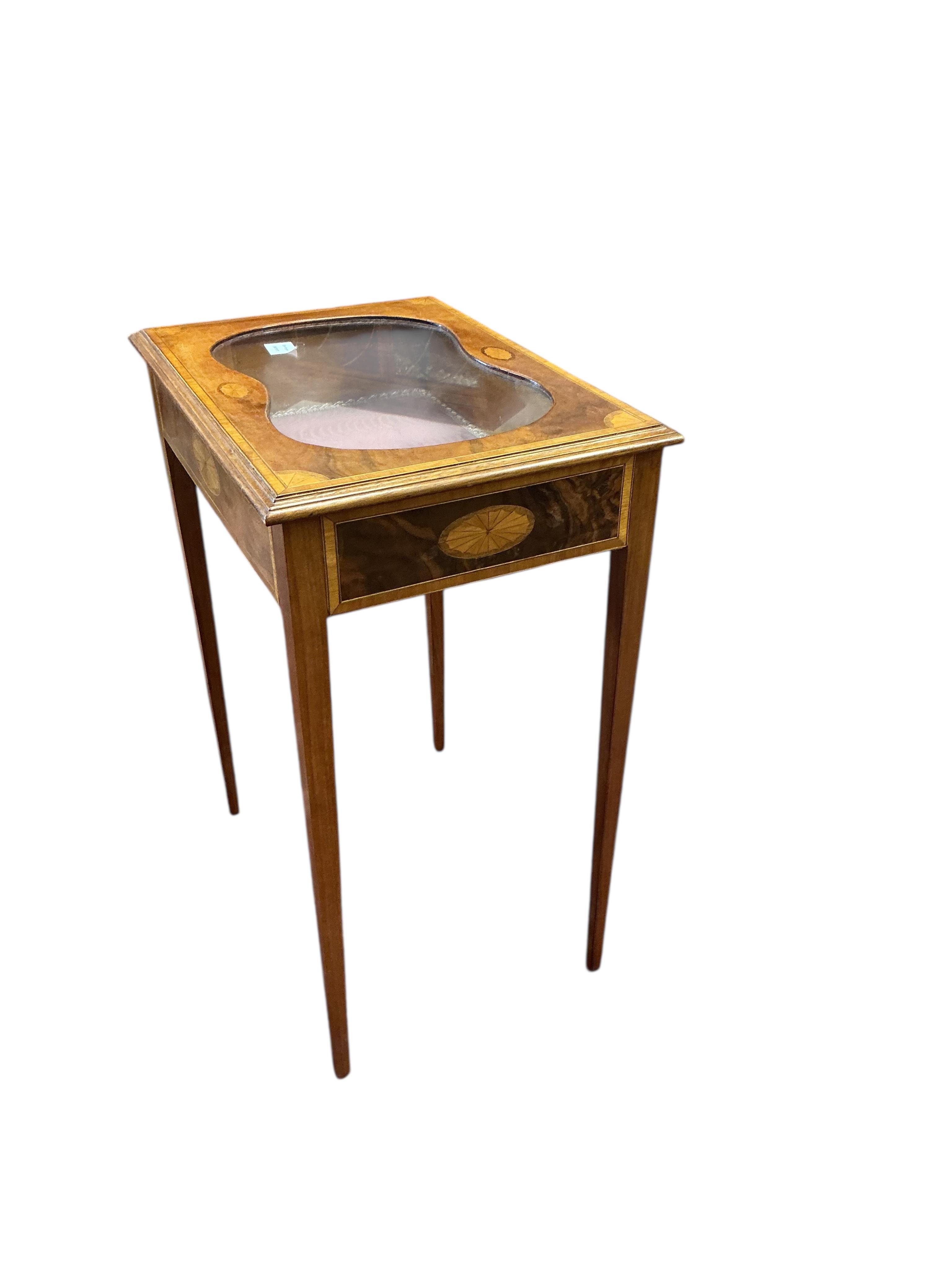 An Edwardian style inlaid mahogany bijouterie table, width 58cm, depth 41cm, height 76cm
